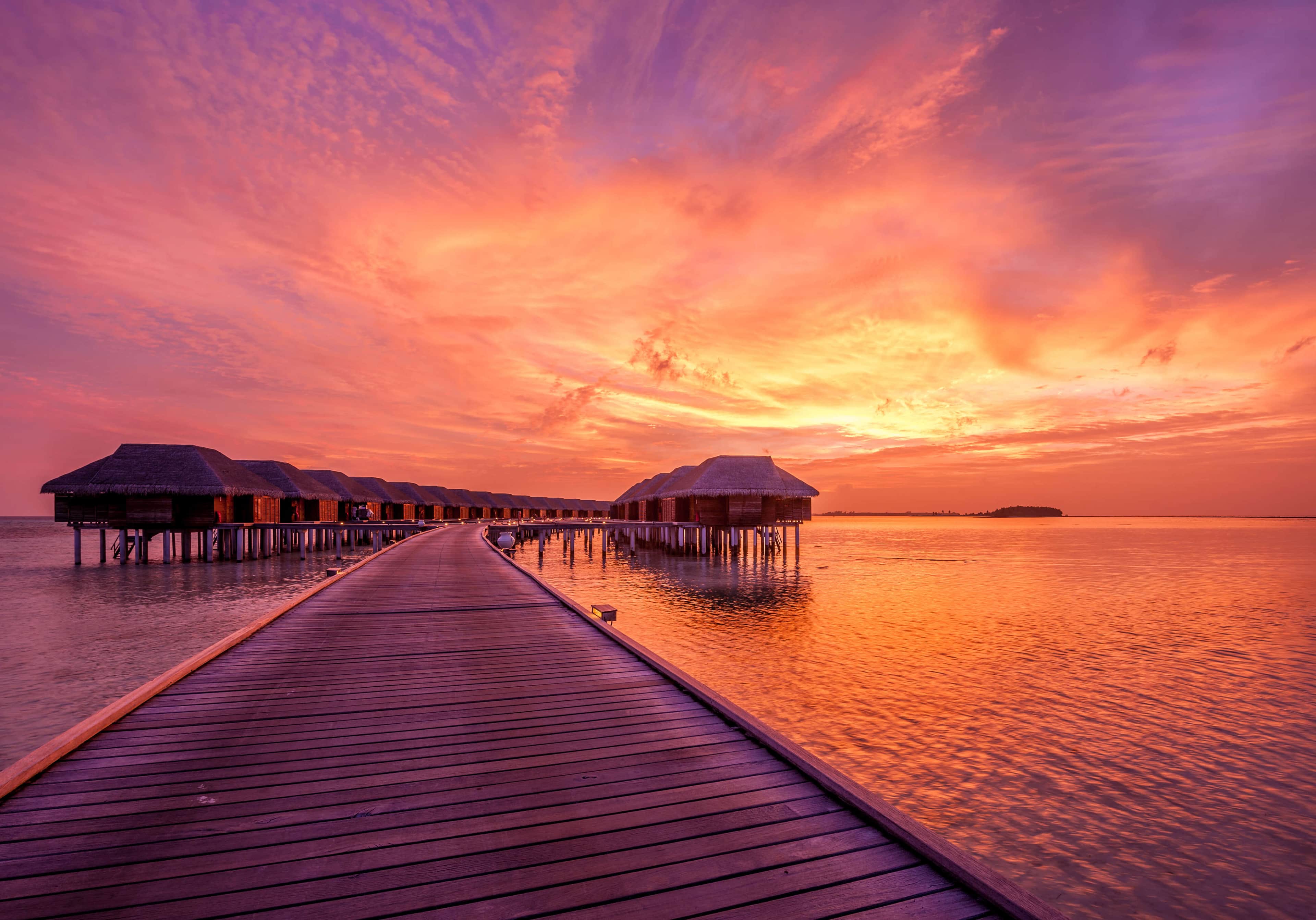 Bungalows in the heart of maldives at sunset